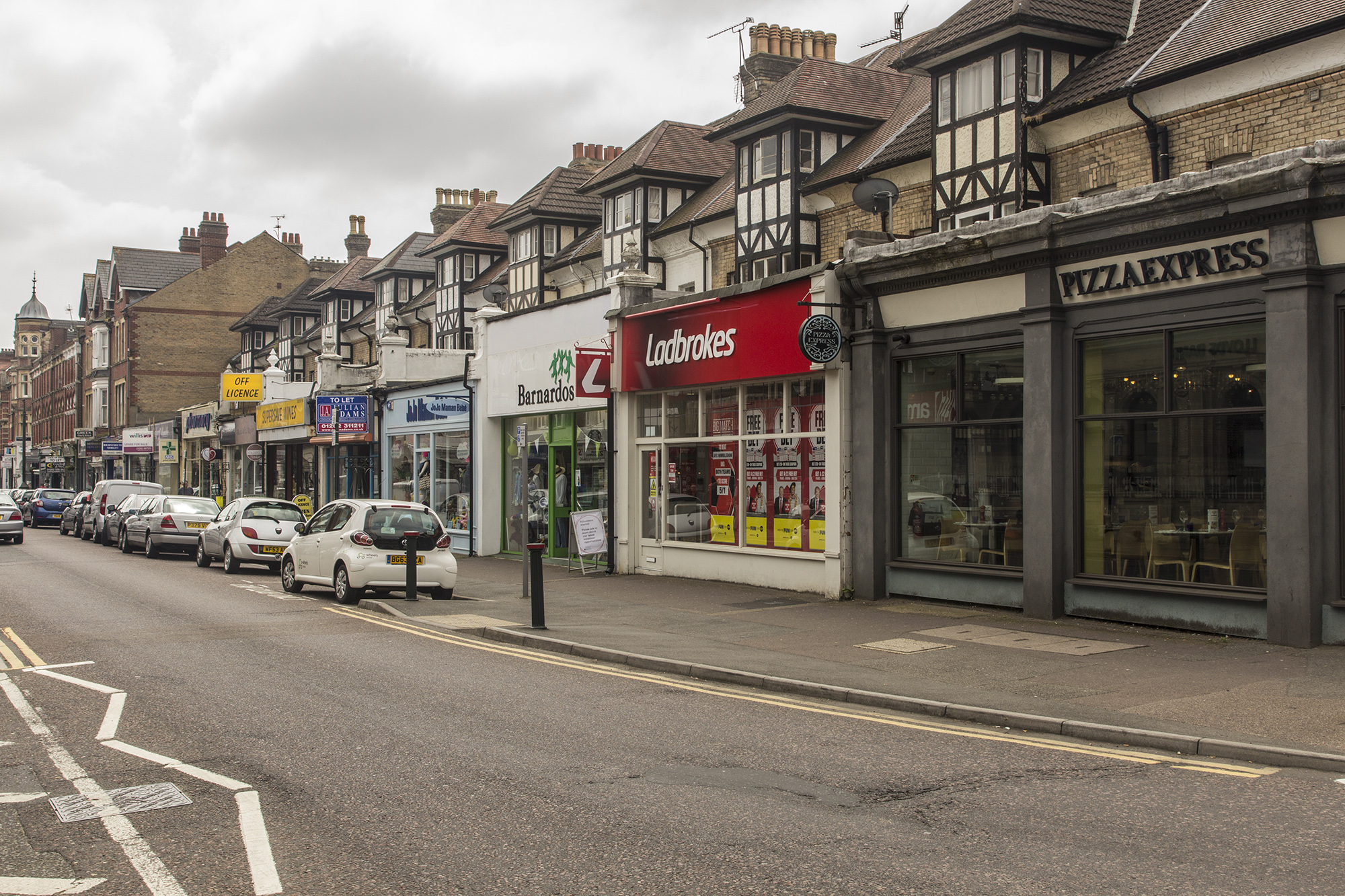 Shops in Poole Road, Westbourne. Always worth looking above the shopfronts at the remains of the original buildings.